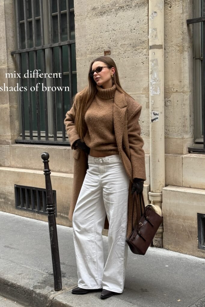 Camel Oversized Coat + Brown Turtleneck Sweater + White Wide-Leg Jeans + Dark Brown Boots