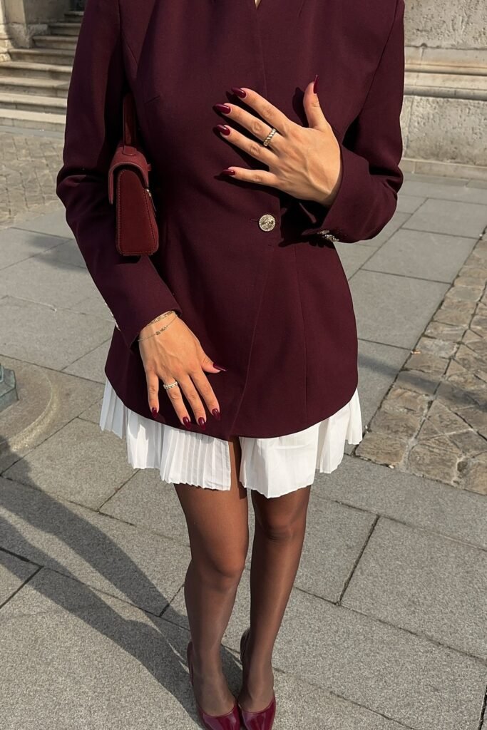 Deep Burgundy Structured Blazer + White Pleated Mini Skirt + Sheer Black Tights + Burgundy Pointed-Toe Heels