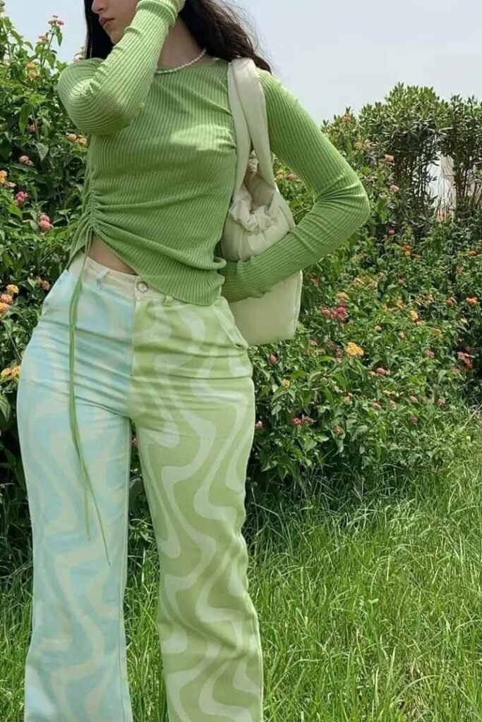 Green Ribbed Long-Sleeve Top + Green and Blue Swirl Patterned Trousers + White Shoulder Bag