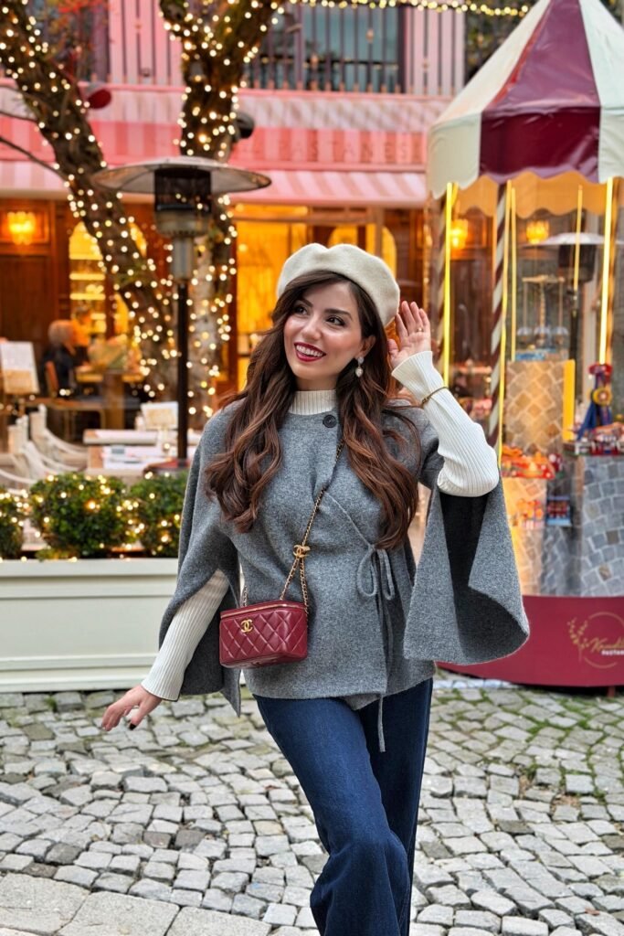 Grey Cape Sweater + White Ribbed Turtleneck + Dark Blue Jeans + Cream Beret