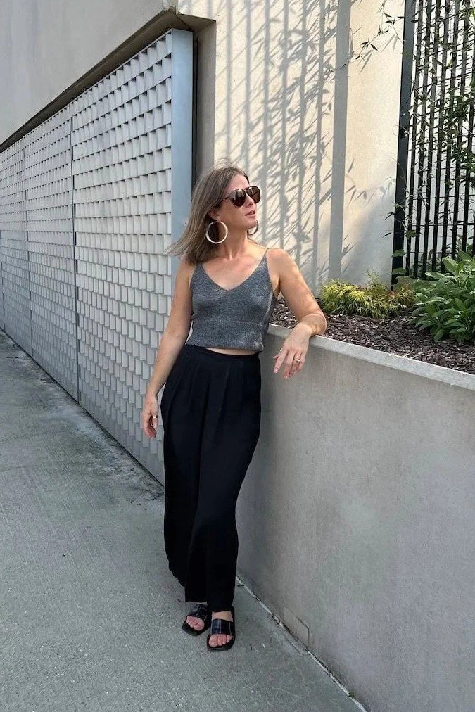 Grey Knit Camisole + High-Waisted Black Wide-Leg Trousers + Black Slide Sandals