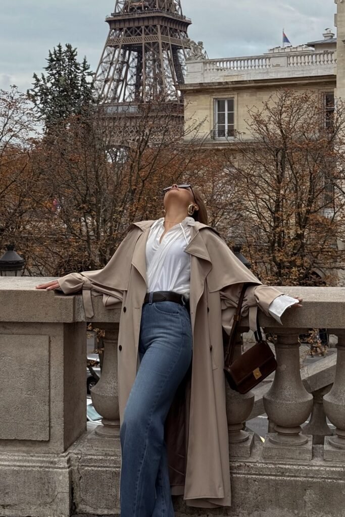 Long Beige Trench Coat + White Silky Blouse + High-Waist Wide-Leg Jeans