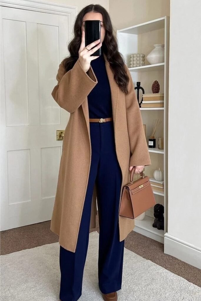 Long Camel Wool Coat + Navy Blue Turtleneck + Navy Wide-Leg Trousers + Brown Leather Handbag