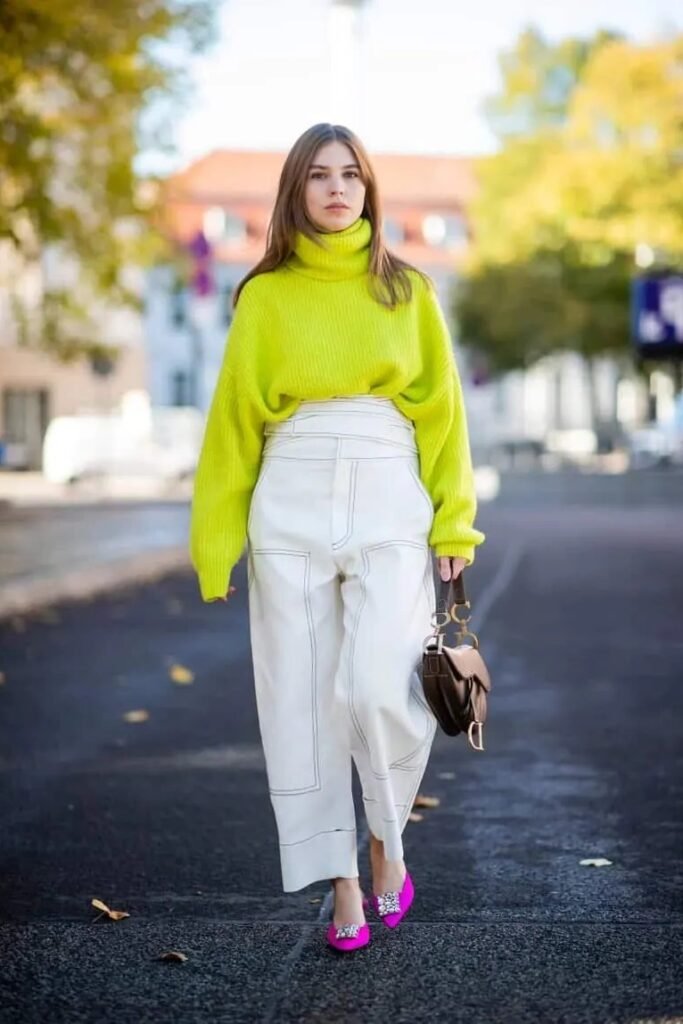 Neon Yellow Oversized Turtleneck Sweater + White High-Waisted Contrast-Stitch Trousers + Hot Pink Embellished Flats
