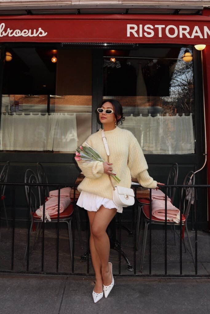 Oversized Cream Cable-Knit Sweater + White Ruffled Mini Skirt + White Pointed-Toe Flats