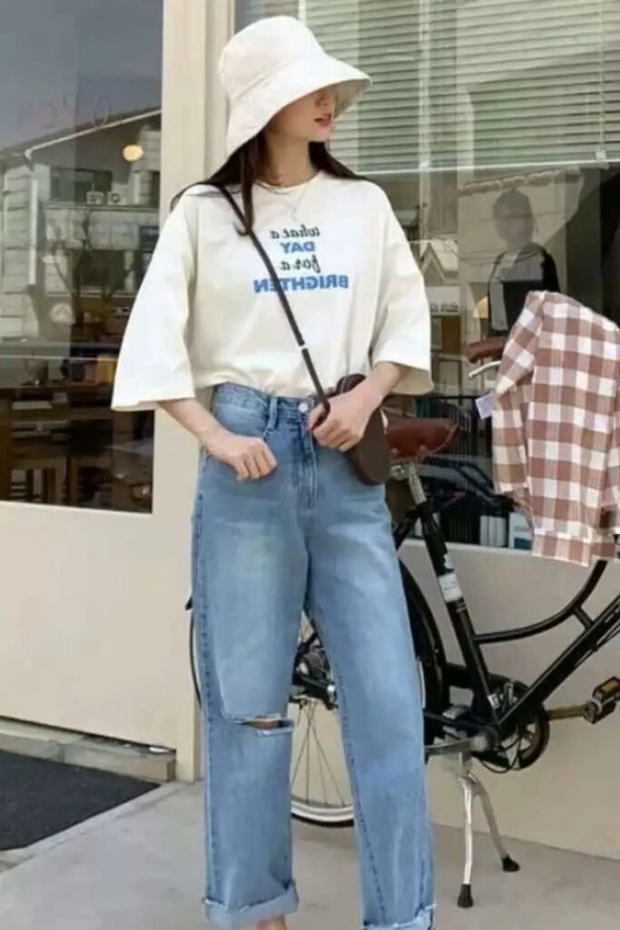Oversized Graphic T Shirt + Light Wash Distressed Jeans + White Bucket Hat