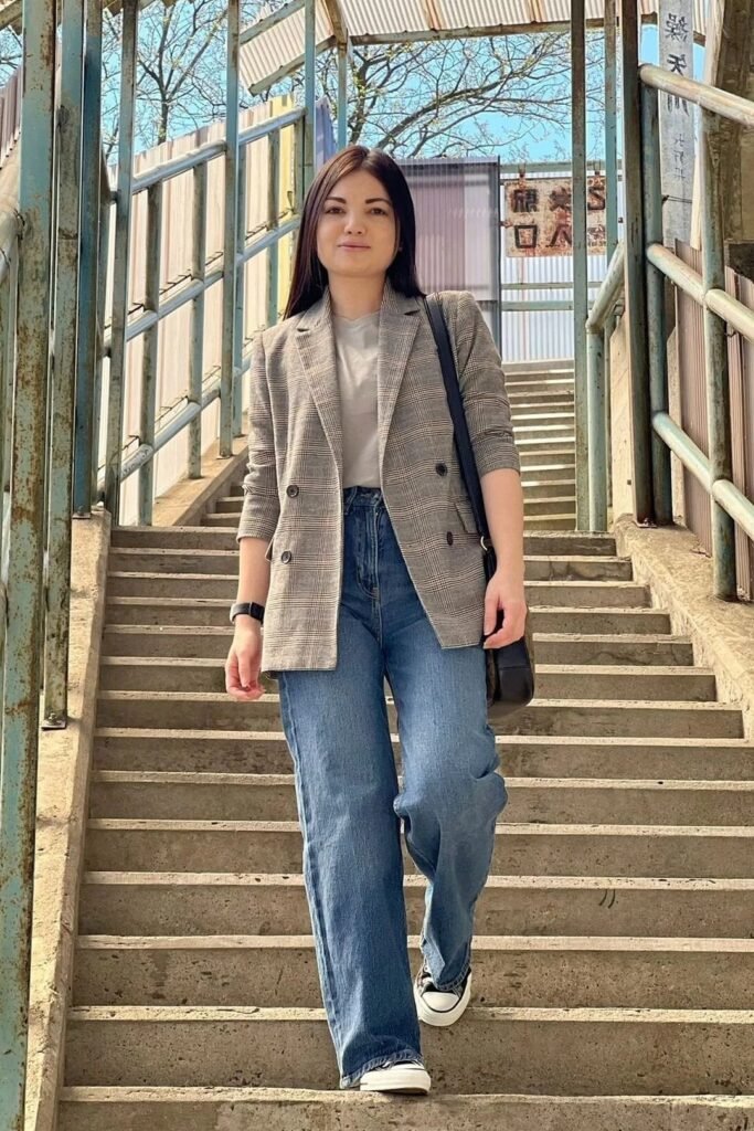 Plaid Grey Blazer + Grey T-shirt + Wide-leg Blue Jeans + Black and White Sneakers