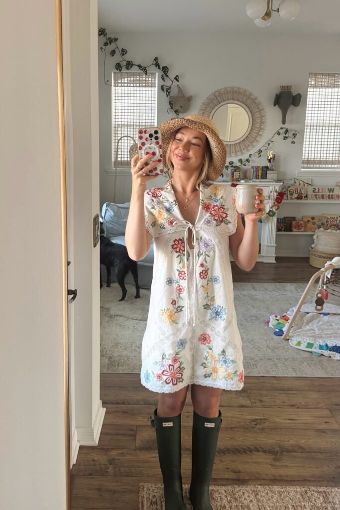 White Embroidered Eyelet Mini Dress + Straw Bucket Hat + Dark Green Tall Rain Boots