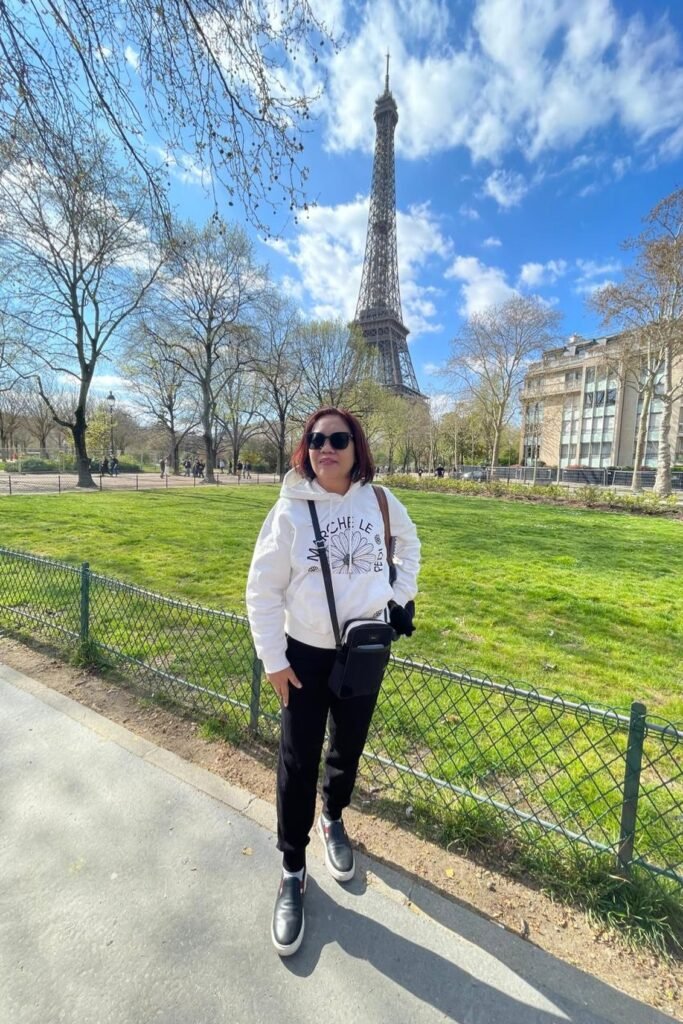 White Graphic Hoodie + Black Joggers + Black Slip-on Sneakers