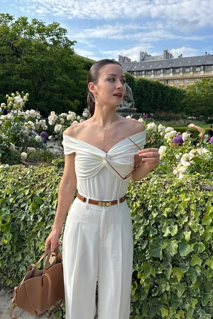 White Off-the-Shoulder Twisted Bodysuit + White High-Waisted Trousers + Tan Leather Belt + Tan Tote Bag