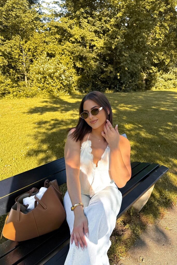 White Ruffle Halter Top + Light Wash Jeans + Gold Accessories