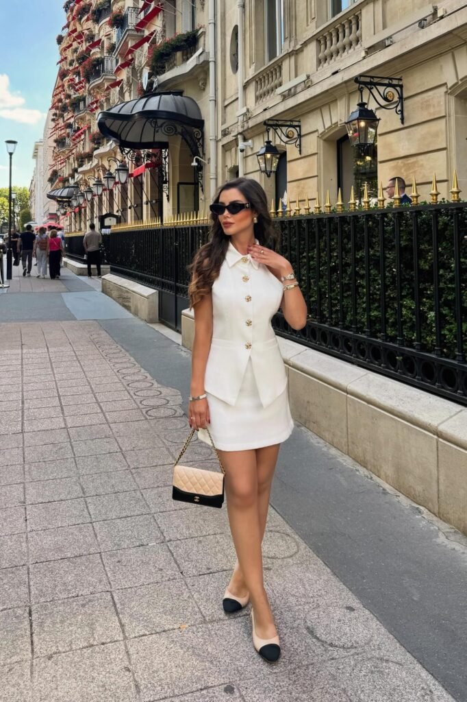 White Sleeveless Button-Down Vest + White Mini Skirt + Two-Tone Cap-Toe Flats
