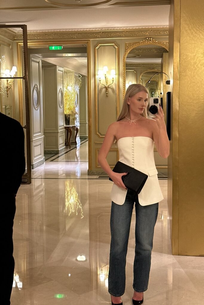 White Strapless Button-Up Corset Top + Medium Wash Straight-Leg Jeans + Black Clutch + Black Heels