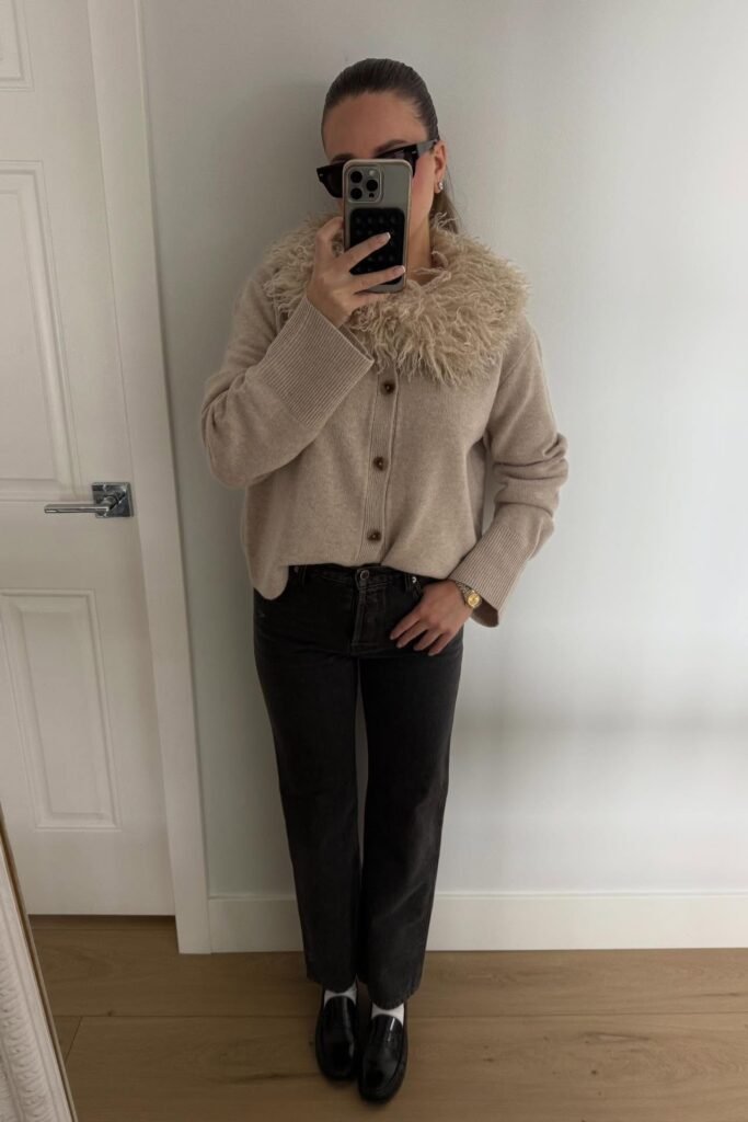 Beige Cardigan with Faux Fur Collar + Dark Grey Straight Leg Jeans + White Socks + Black Leather Loafers