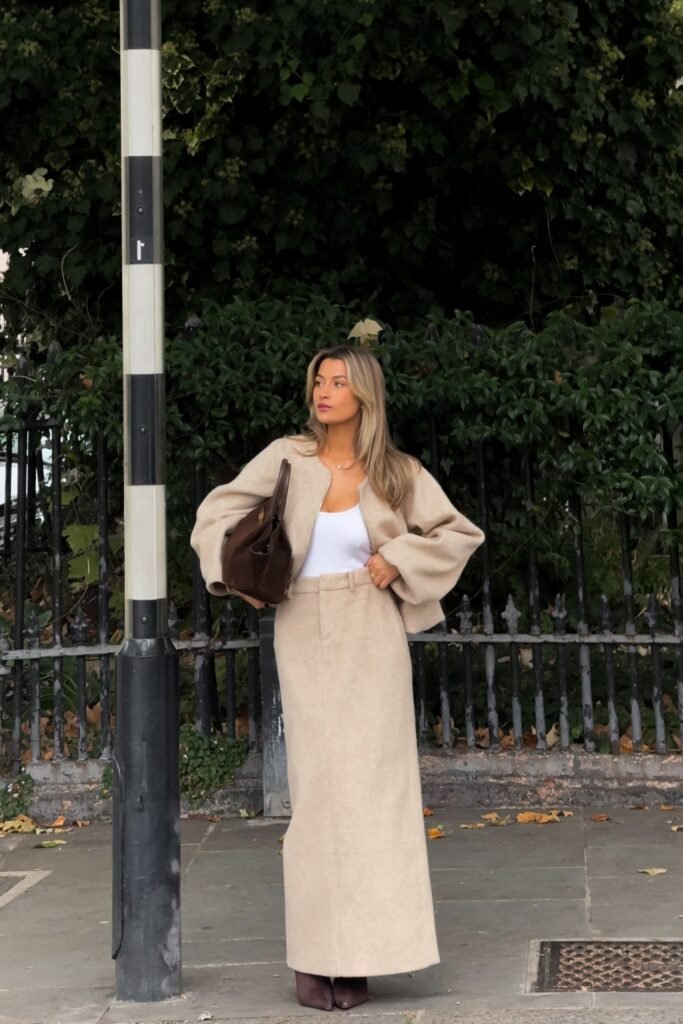 Beige Cropped Jacket + White Bodysuit + Matching Beige Maxi Skirt + Dark Brown Suede Bag