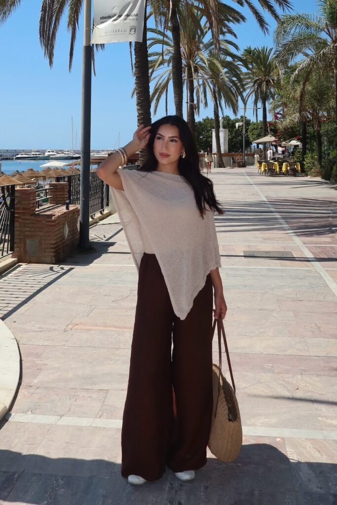 Beige Knit Asymmetrical Poncho + Dark Brown Wide Leg Trousers + White Sneakers