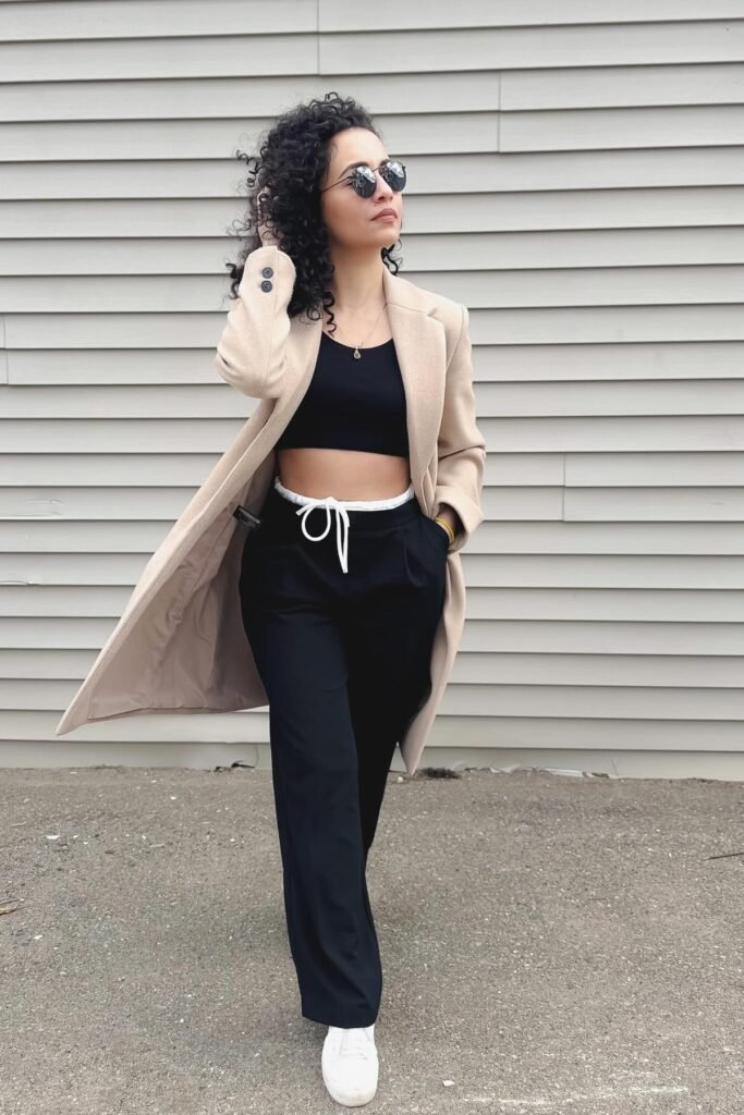 Beige Long Coat + Black Crop Top + Black Wide Leg Trousers + White Sneakers