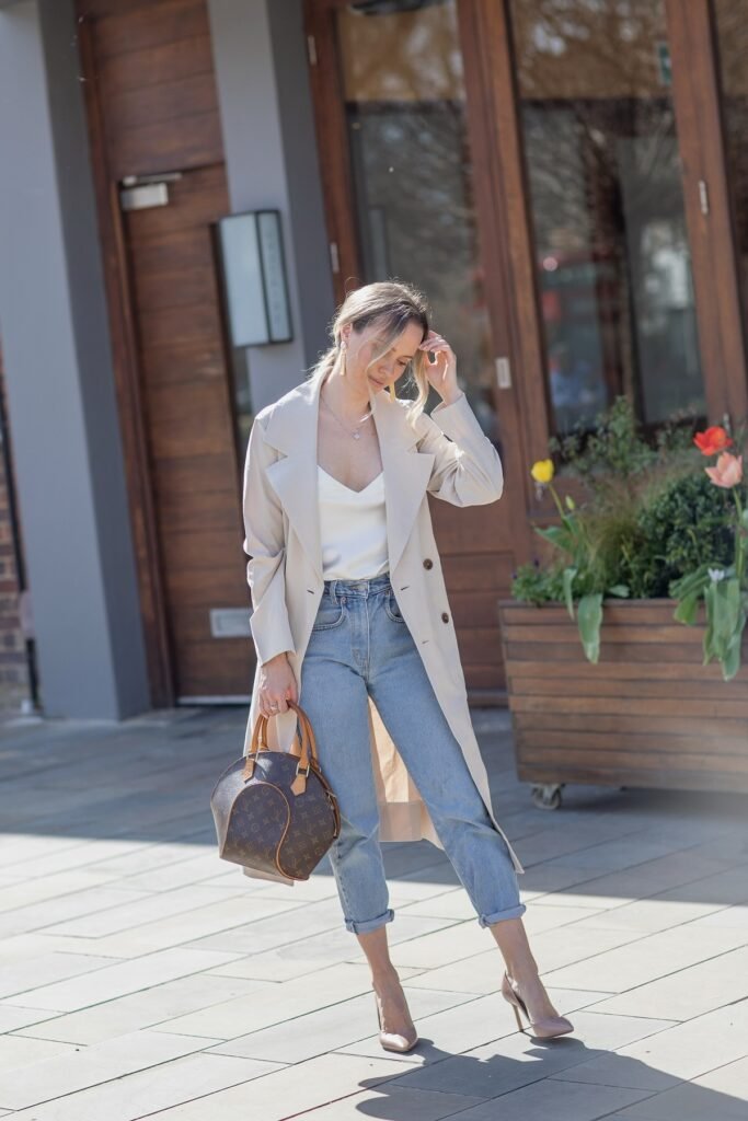 Beige Trench Coat + White Silk Camisole + Light Blue Cuffed Jeans + Nude Pointed Heels