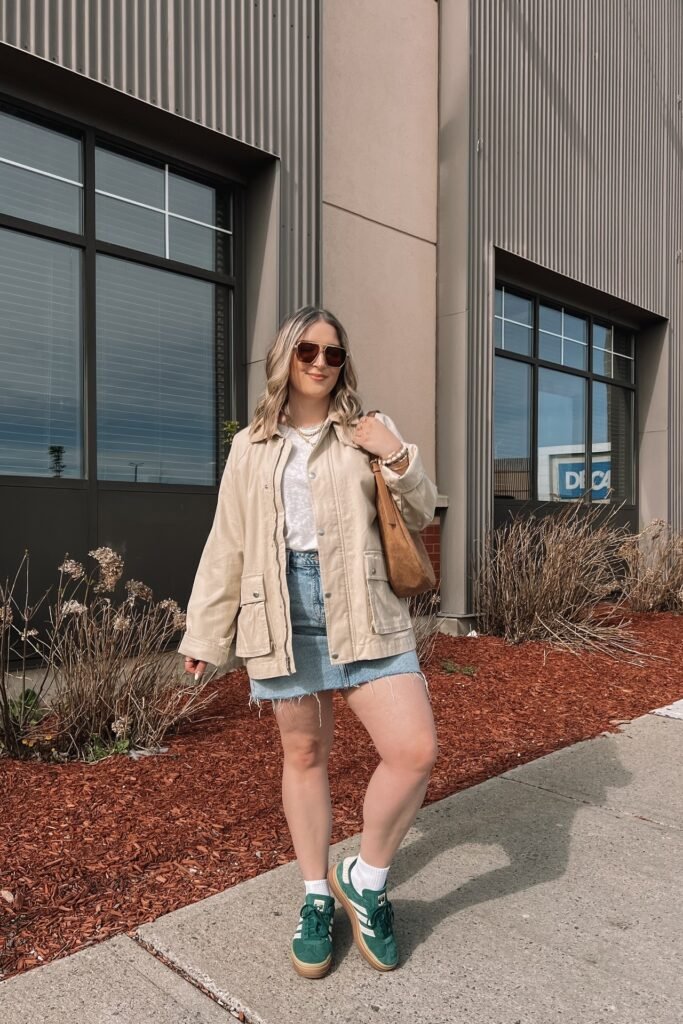 Beige Utility Jacket + White T-shirt + Denim Mini Skirt + Green Suede Sneakers