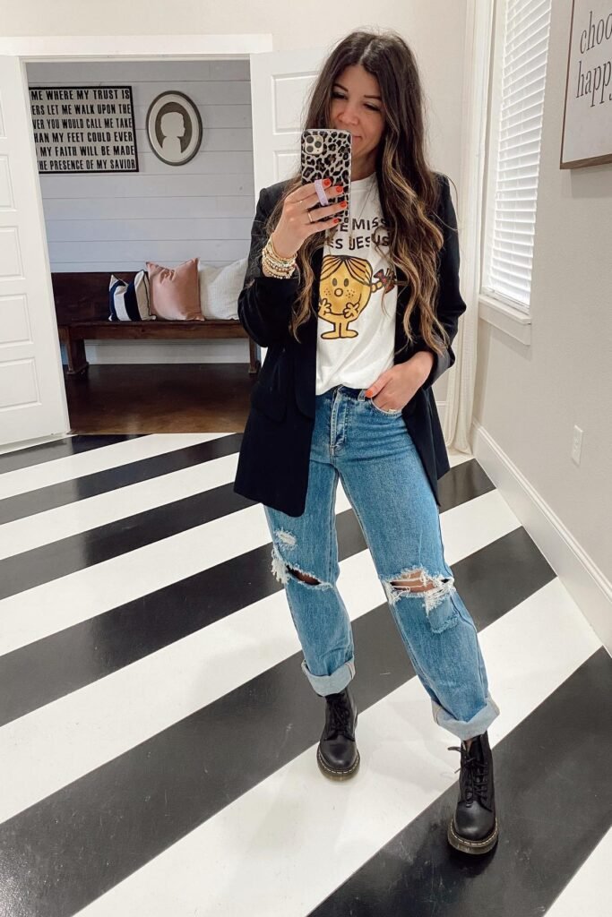 Black Blazer + Graphic Tee + Distressed Blue Jeans + Black Combat Boots