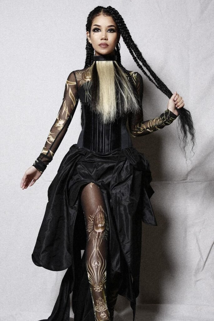 Black Corset Bodice + Sun-Patterned Sheer Sleeves + High-Slit Voluminous Black Skirt