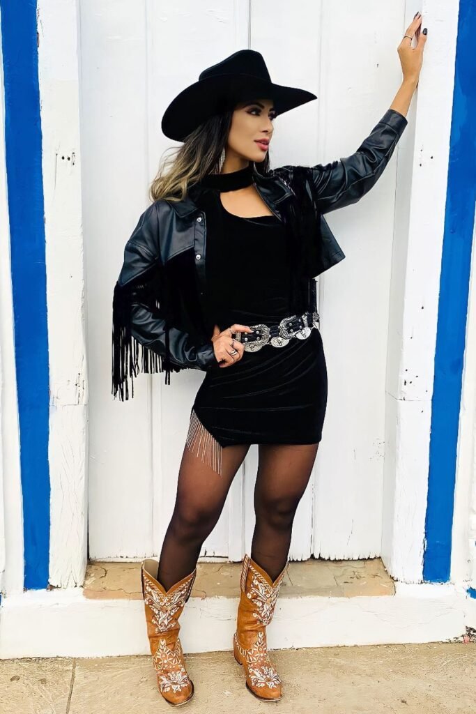 Black Cowboy Hat + Black Fringe Leather Jacket + Black Velvet Mini Dress + Tan Patterned Cowboy Boots