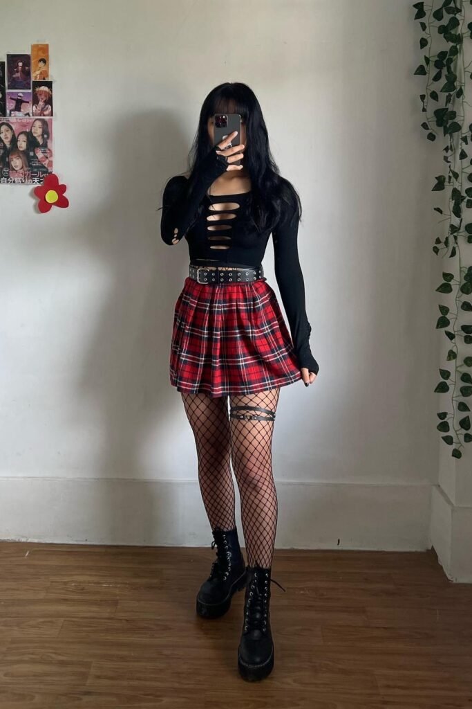 Black Cut out Long Sleeve Top + Red Plaid Mini Skirt + Fishnet Tights + Black Lace up Combat Boots