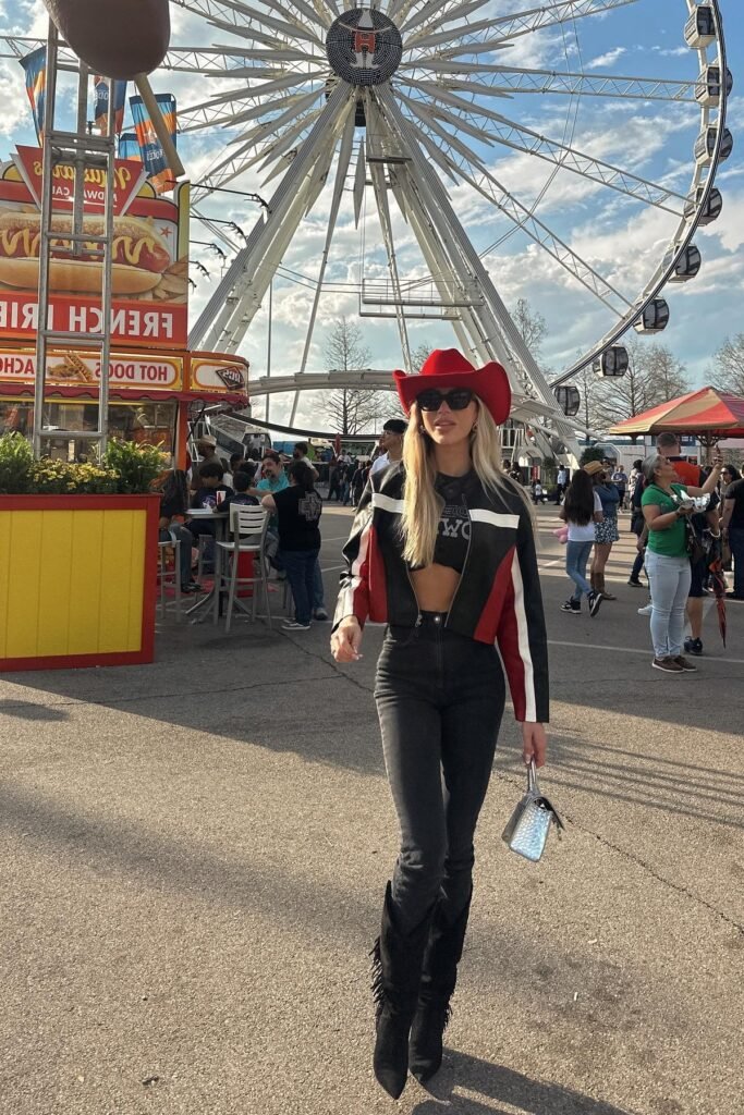 Black Graphic Crop Top + Red and Black Leather Racing Jacket + Black Fringed Boots