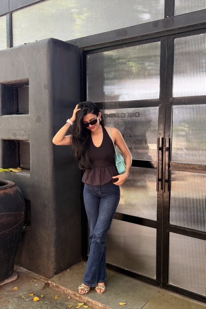 Black Halter Peplum Top + Dark Blue Flare Jeans + Gold Strappy Sandals