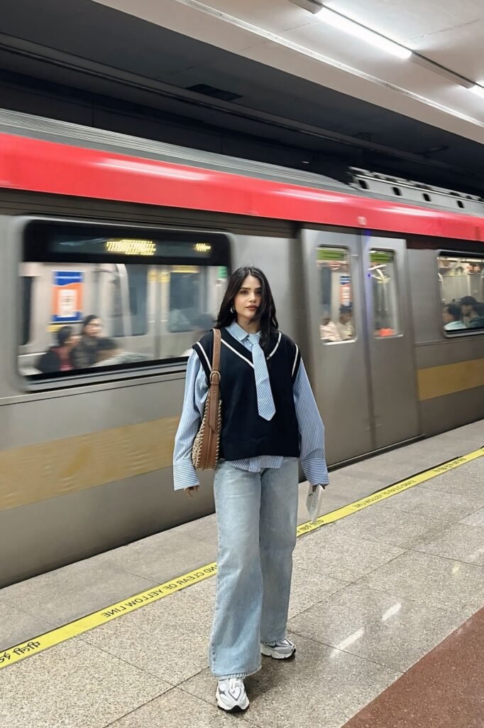 Black Knit Vest and Blue Striped Shirt with Tie + Light Wash Baggy Jeans + White and Grey Sneakers