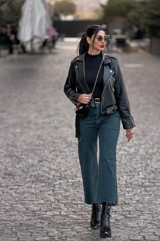 Black Leather Biker Jacket + Black Mock Neck Top + Dark Wash Wide Leg Jeans + Black Patent Boots