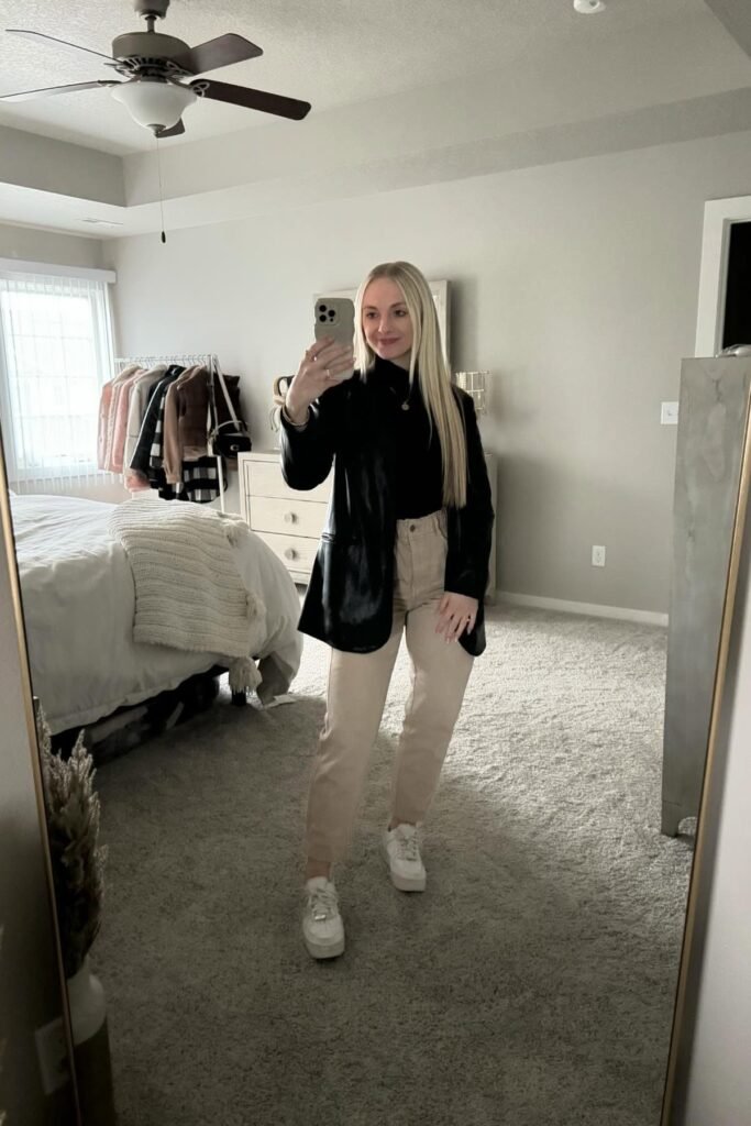 Black Leather Blazer + Black Turtleneck + Tan Straight-Leg Jeans + White Sneakers