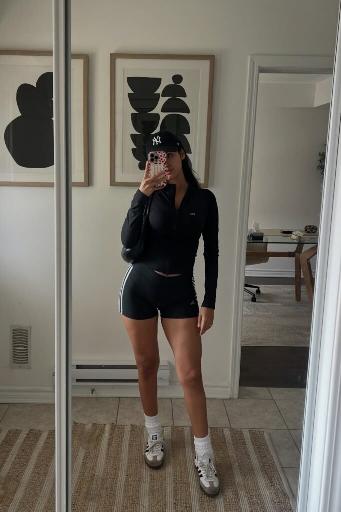 Black Long-Sleeve Performance Top + Black Athletic Shorts + White Sneakers