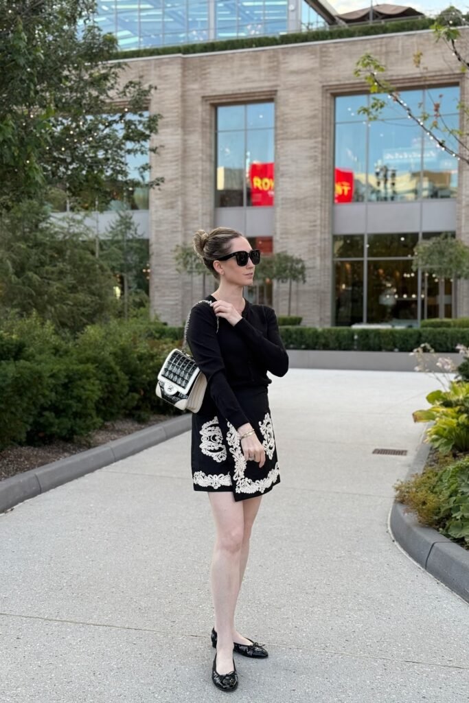 Black Long Sleeve Top + Black and White Patterned Mini Skirt + Black Patent Ballet Flats