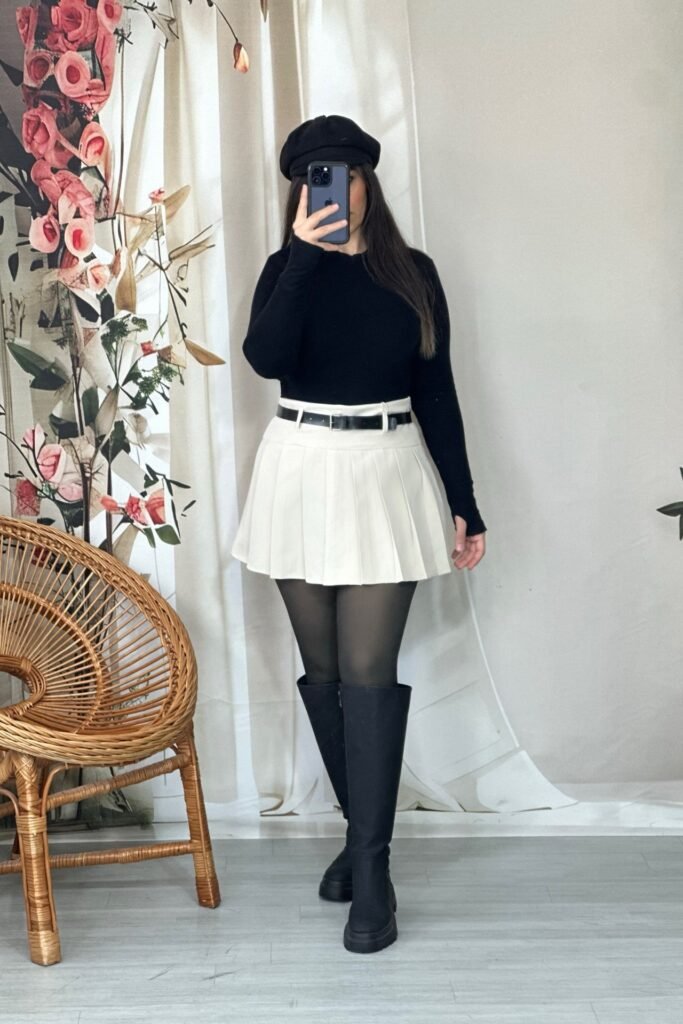 Black Long-Sleeve Top + White Pleated Mini Skirt + Black Knee-High Boots + Black Beret