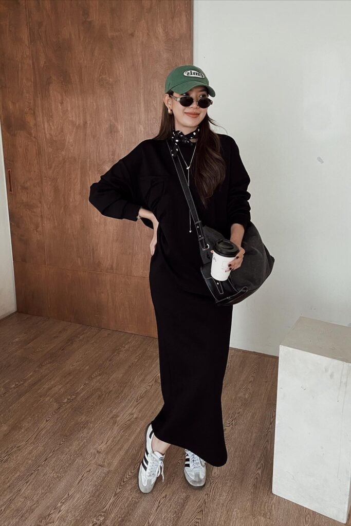 Black Maxi Dress + Green Baseball Cap + Black & White Athletic Sneakers