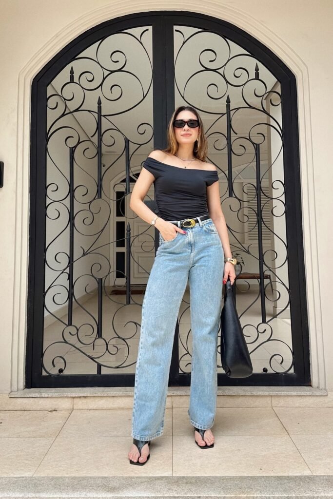 Black Off-the-Shoulder Bodysuit + Light Wash Straight-Leg Jeans + Black Thong Sandals