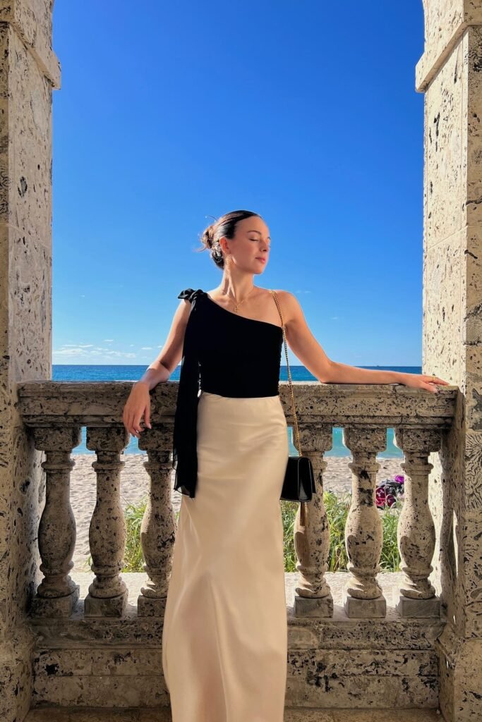 Black One Shoulder Ribbon Top + Cream Satin Maxi Skirt + Black Chain Strap Purse