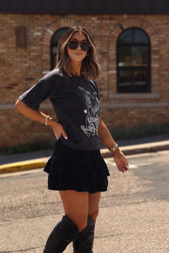 Black Oversized Graphic T-Shirt + Black Ruffled Mini Skirt + Black Western-Style Boots