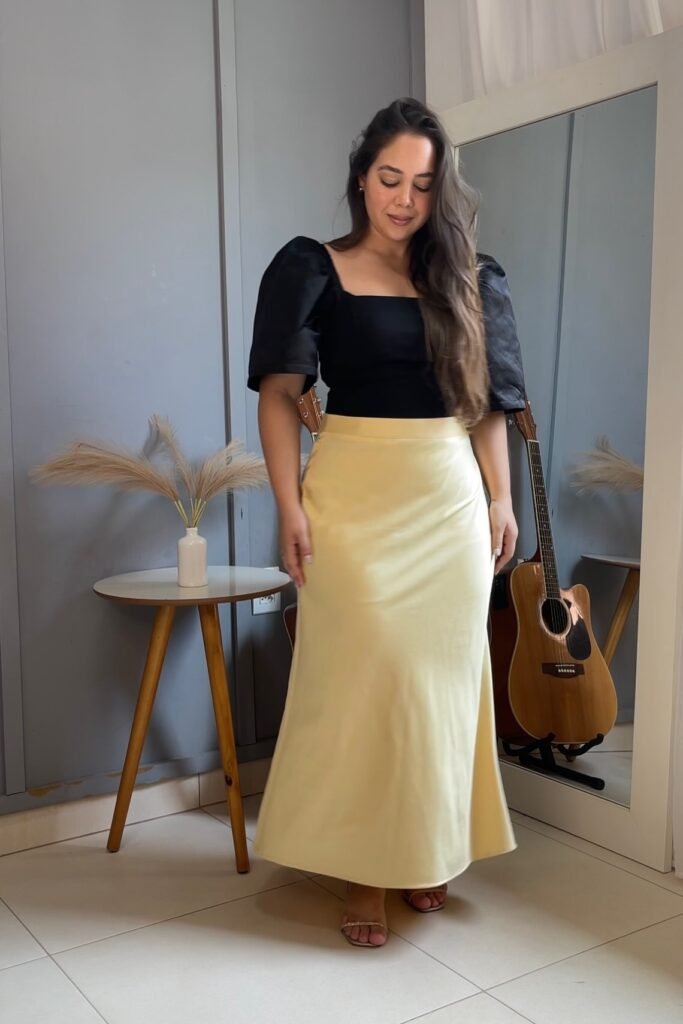 Black Puff-Sleeve Square-Neck Top + Pale Yellow Satin Maxi Skirt + Embellished Sandals