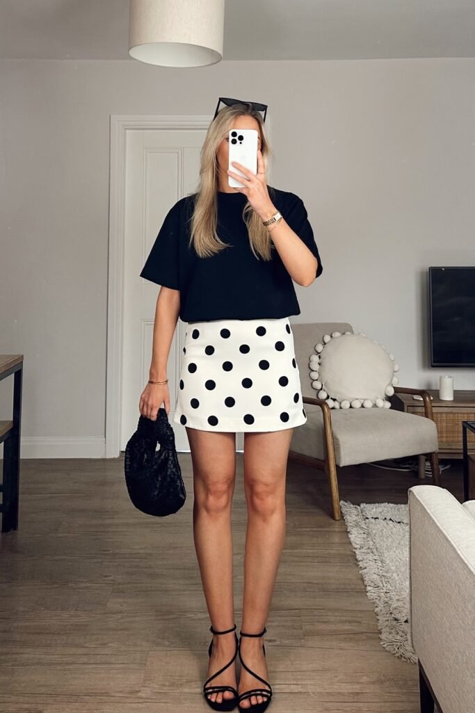 Black Short-Sleeve T-Shirt + White Polka Dot Mini Skirt + Black Strappy Sandals