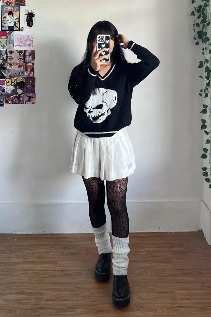 Black Skull Sweater + White Pleated Mini Skirt + Black Patterned Tights + White Leg Warmers + Black Platform Shoes