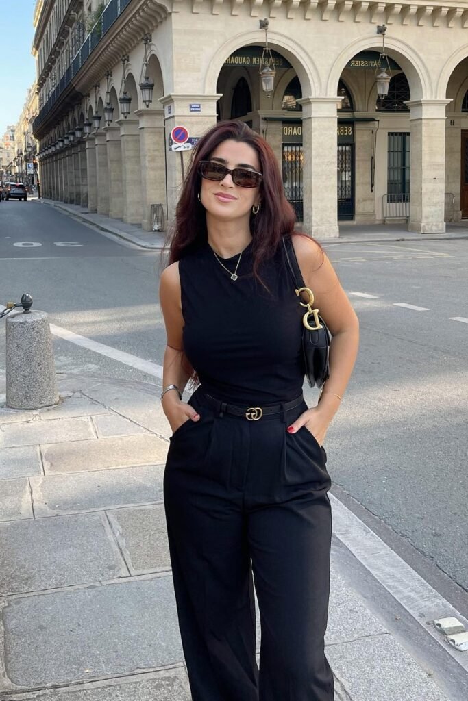 Black Sleeveless Bodysuit + Black Pleated Trousers + Black Gold Buckle Belt