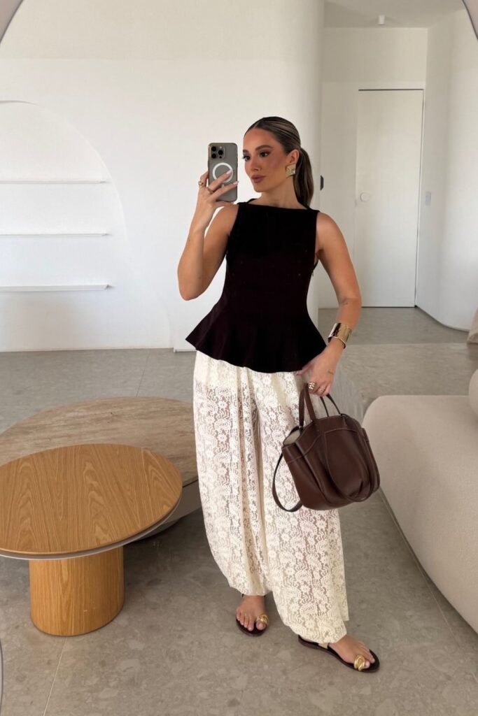 Black Sleeveless Peplum Top + White Intricate Lace Wide-Leg Trousers + Gold Thong Sandals