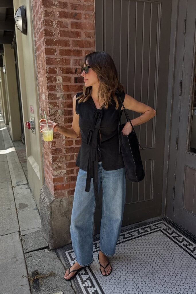 Black Sleeveless Tie-Front Blouse + Light Wash Wide-Leg Jeans + Black Flip-Flops