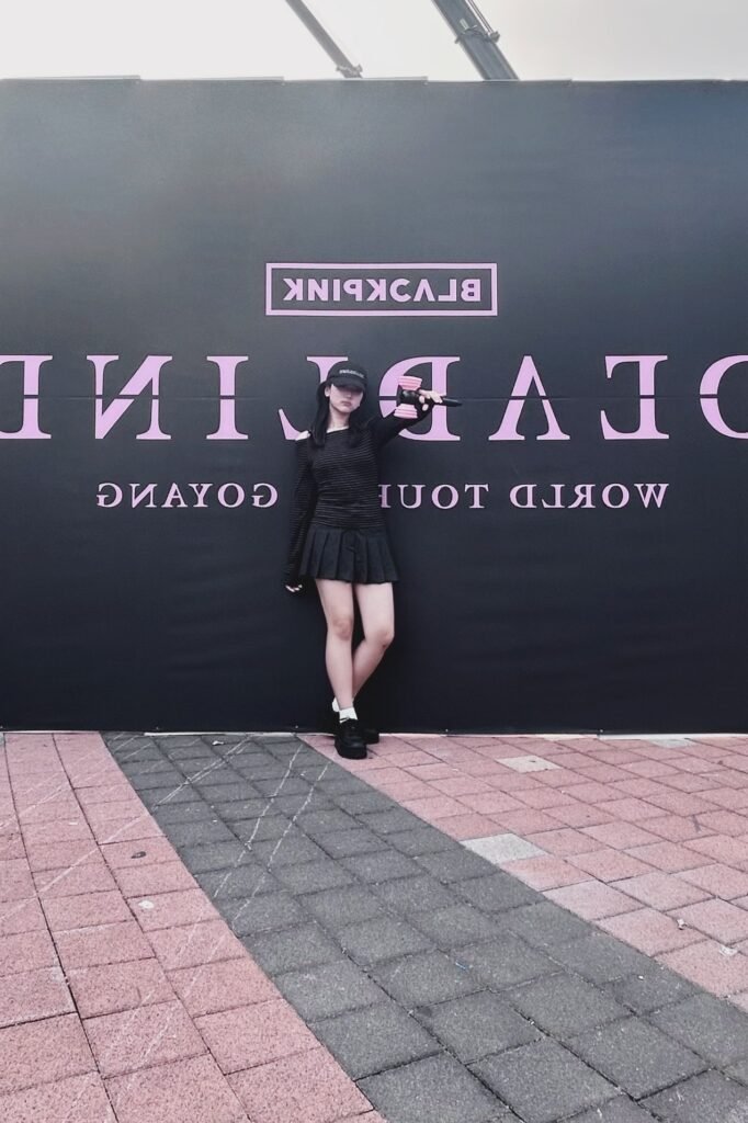 Black Striped Long Sleeve Off-the-Shoulder Top + Black Pleated Mini Skirt + White Socks + Black Platform Loafers