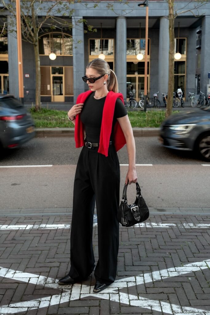Black T Shirt + Red Sweater (Over Shoulders) + Black Trousers + Black Boots