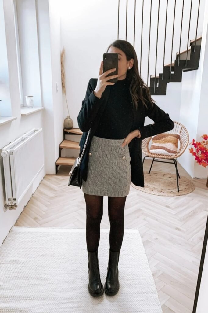Black Turtleneck + Grey Cable-Knit Mini Skirt + Black Blazer + Black Lug Sole Boots
