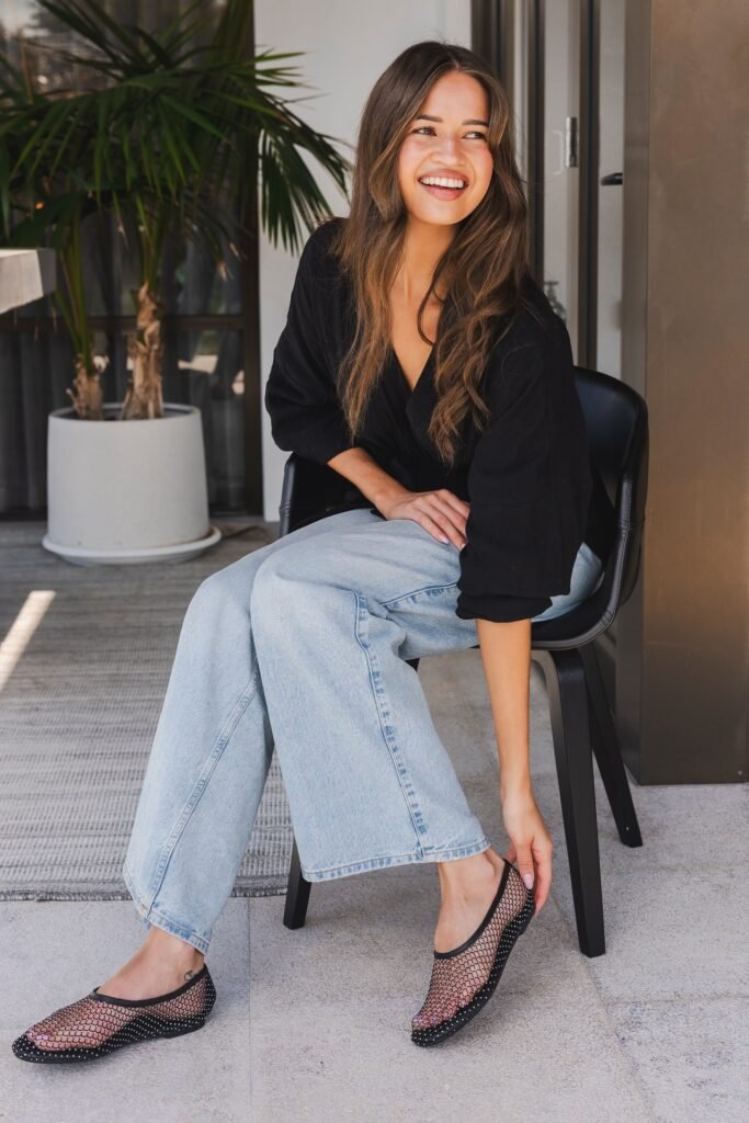 Black V Neck Blouse + Wide Leg Light Wash Jeans + Black Rhinestone Mesh Flats