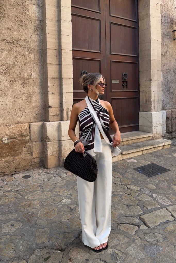 Black and White Zebra Print Halter Scarf Top + White Wide Leg Trousers + Brown Woven Clutch